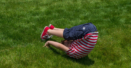 Somersault in the grass