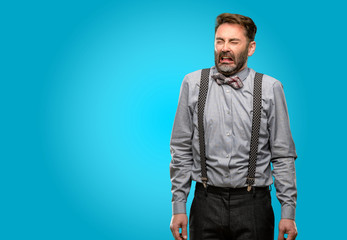 Canvas Print - Middle age man, with beard and bow tie crying depressed full of sadness expressing sad emotion