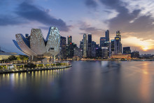 Skyline Of Singapore With Sunset And City Light