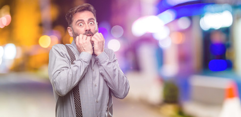 Sticker - Middle age man, with beard and bow tie terrified and nervous expressing anxiety and panic gesture, overwhelmed at night club