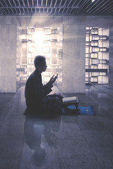 Wall Mural - Muslim man praying to the Allah in mosque