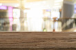 © nirut - Empty wooden table platform blur background