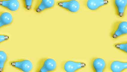 Wall Mural - Blue painted lightbulbs on a yellow background