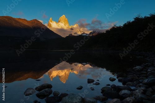 Alpenglow morning light of Mount Fitz Roy and its reflection on Laguna Capri, mountain in Patagonia, on border between Argentina and Chile Poster