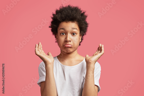 Puzzled Handsome Mixed Race Teenager With Afro Hairstyle Cuves