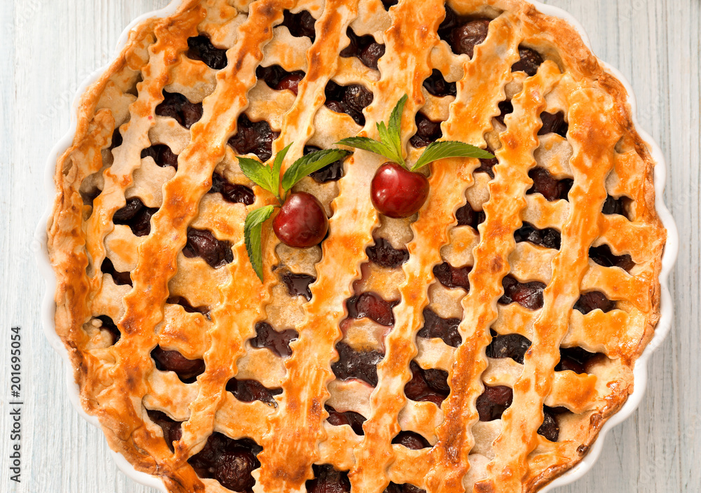Delicious cherry pie on kitchen table