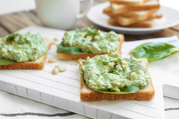 Wall Mural - Toasts with tasty spinach sauce on table