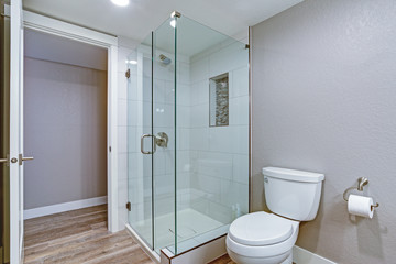 Elegant bathroom with hardwood floor.