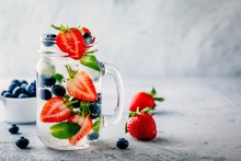 Infused Detox Water With Blueberry, Strawberry And Mint. Ice Cold Summer Cocktail Or Lemonade.