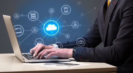 Businessman hand typing with cloud technology system and office symbol concept
