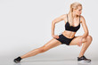 © Rychko Yevhen - woman in sportswear does exercises
