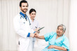 © Art_Photo - Doctor holding elderly person patient hand with care and consulting in hospital.healthcare and medicine