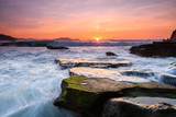 Fototapeta Zachód słońca - amazing sunset landscape at rocky beach