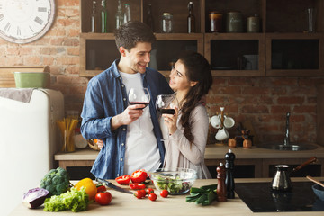 Happy couple cooking healthy food together