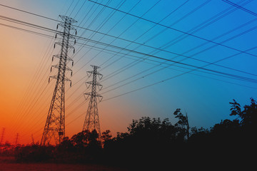 Wall Mural - high voltage poles on the orange sky concept of electric power