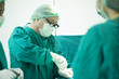© Bavorndej - The surgery team working together at the operating room in the hospital.