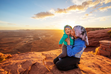 Poster - A mother and her baby son visit Canyonlands National park in Utah, USA