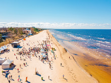 Aerial View From Drone On Crowd Of People Who Is Starting Are Running On Marathon Event By The Sea Shore In Jurmala, Latvia.