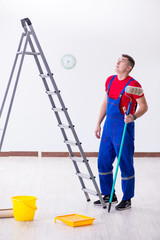 Wall Mural - Male painter preparing for painting job at construction site