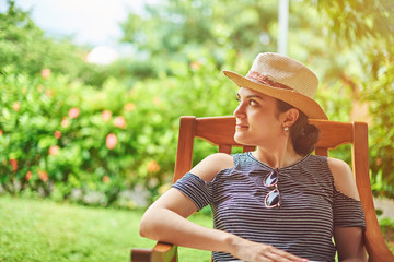 Wall Mural - Portrait of young woman in hat