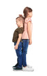 © New Africa - Little children measuring and comparing their height on white background