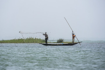 fishing from wooden canoes on the niger river, mali