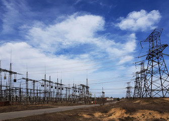  high-voltage  power lines at storm clouds.