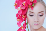 Fototapeta  - Young beauty woman with flower near face