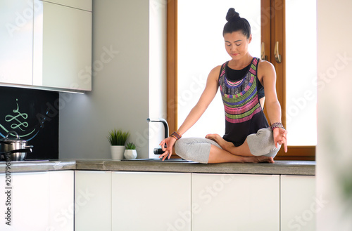 Fotografía Fit and attractive young woman preparing healthy meal. Woman.