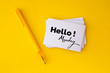 © Cozine - the yellow pen and stacking of  white business card with Hello Monday message on vibrant yellow background , cheerful for happy working time  Monday concept