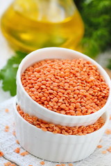 Wall Mural - Red lentil on a wooden table