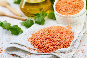 Wall Mural - Red lentil on a wooden table