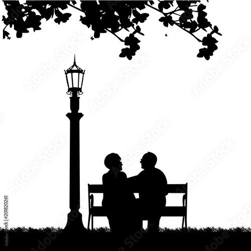Lovely Retired Elderly Couple Sitting On Bench In Park Or Garden One