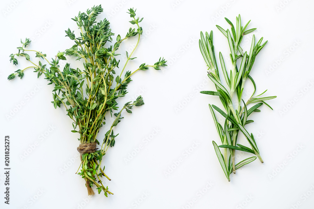 Bunches of tied thyme and rosemary on white background isolated - obrazy, fototapety, plakaty 
