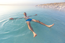 Tourist Swims In Dead Sea. Jordan