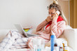 © Kaspars Grinvalds - Sick woman working from home