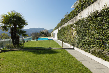 Wall Mural - Exterior of building with swimming pool overlooking the hills