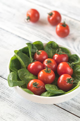 Sticker - Fresh cherry tomatoes with spinach leaves