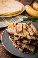 Wall Mural - Pancakes with banana and cacao cream. Les crêpes.