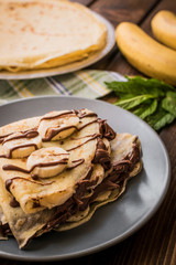 Wall Mural - Pancakes with banana and cacao cream. Les crêpes.