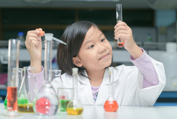Wall Mural - happy little scientist making experiment