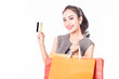 Happy Beautiful Asian woman holding credit card and shopping bags,Isolated on white background,Shopping concept