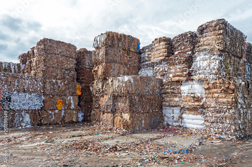 Waste paper recycling.Pile of pressed waste paper bales in the yard