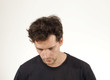 © lukas_zb - Upset man in black T-shirt