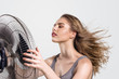 © Svetlana Radayeva - Young woman with cooler fan