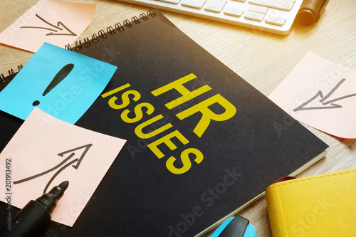 Fotomural Book about HR issues on a desk.