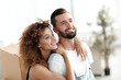 © ASDF - Portrait of a loving married couple in a new apartment.