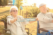 © Africa Studio - Senior man and woman from care home doing exercise outdoors