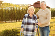 © Africa Studio - Senior woman with walkers and her friend from care home outdoors