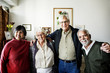 © Rawpixel.com - Group of senior friends arms around each other